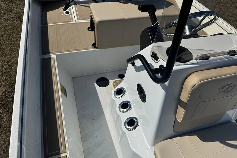 Slide: The Image of 2026 G3 Bay 17 boat interior with beige seating and steering console. - 24