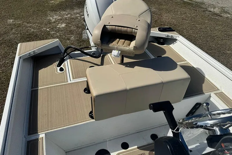 Slide: The Image of 2026 G3 Bay 17 boat interior with beige seating and steering wheel. - 27