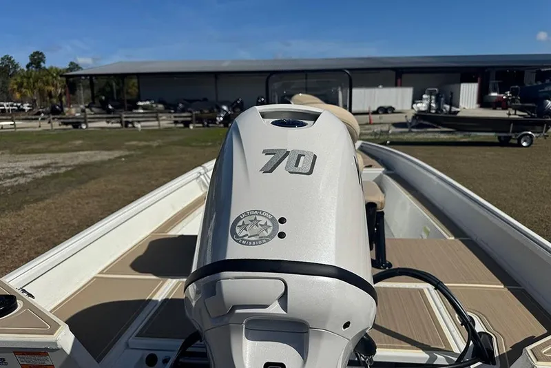 Slide: The Image of 2026 G3 Bay 17 boat with 70 horsepower engine, parked outdoors. - 5