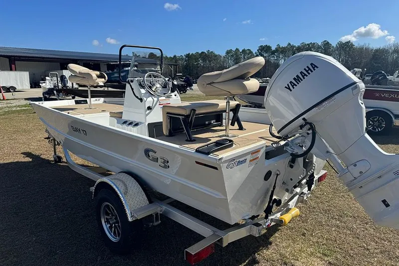 Slide: The Image of 2026 G3 Bay 17 boat with Yamaha motor on a trailer, parked outdoors. - 7