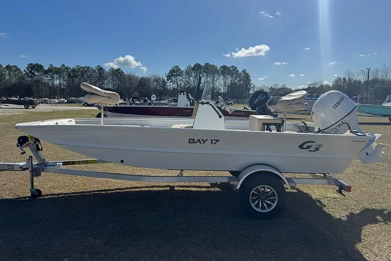 Slide: The Image of 2026 G3 Bay 17 boat on trailer, sunny day, grassy area, Yamaha motor. - 8
