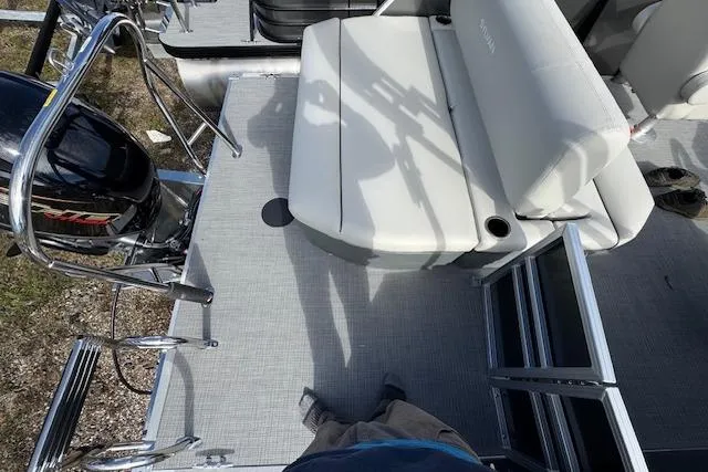 Slide: The Image of 2026 Sylvan 822 Mirage Cruise boat deck with seating and motor. - 7