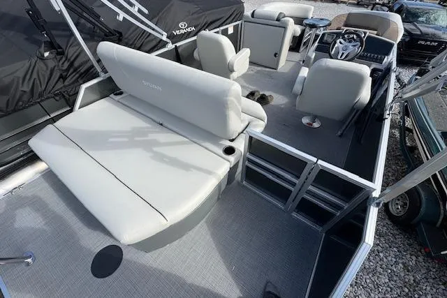 Slide: The Image of 2026 Sylvan 822 Mirage Cruise pontoon boat interior with seating and steering console. - 8