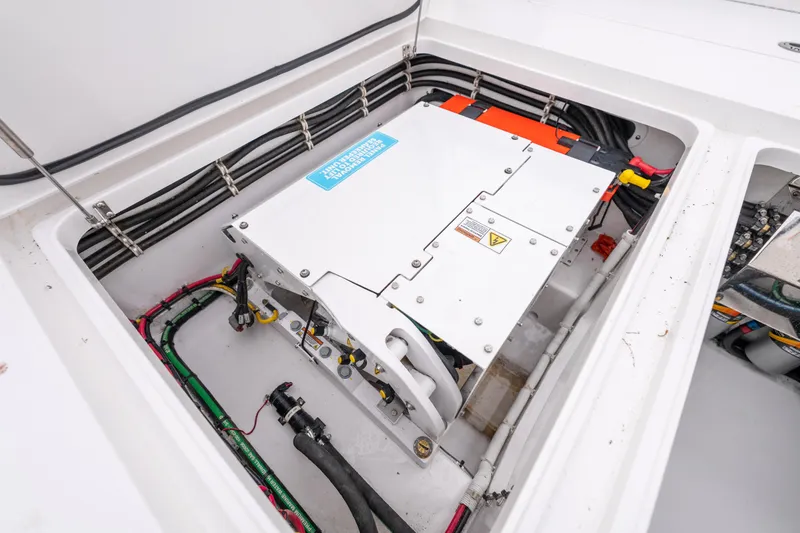 Slide: The Image of 2023 Valhalla Boatworks V-41 electrical system with wiring and components in compartment. - 12