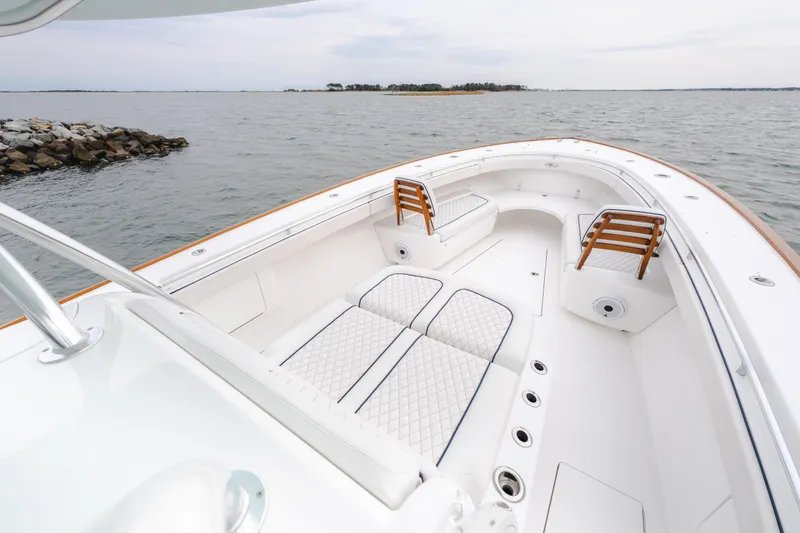 Slide: The Image of 2023 Valhalla Boatworks V-41, luxurious deck view, open water, elegant seating, modern design. - 14