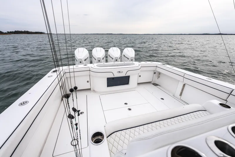 Slide: The Image of 2023 Valhalla Boatworks V-41, spacious deck, multiple engines, on open water. - 15