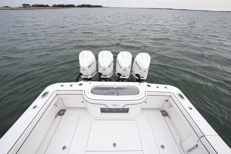 Slide: The Image of 2023 Valhalla Boatworks V-41 with quad outboard engines on open water. - 16