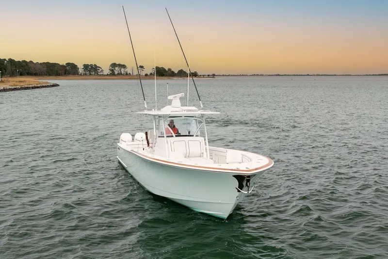 Slide: The Image of 2023 Valhalla Boatworks V-41 cruising on calm waters at sunset. - 3