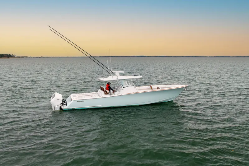 Slide: The Image of 2023 Valhalla Boatworks V-41 cruising on calm waters at sunset. - 5