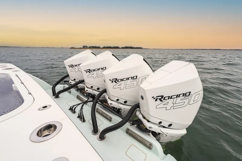 Slide: The Image of 2023 Valhalla Boatworks V-41 with triple Racing 450 engines on open water. - 6
