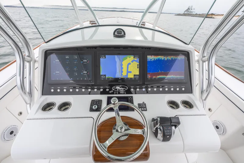 Slide: The Image of 2023 Valhalla Boatworks V-41 helm with advanced navigation displays and controls. - 8