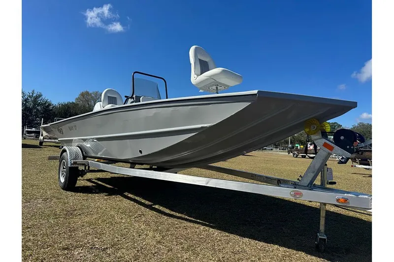 Slide: The Image of 2026 G3 Bay 17 boat on trailer under clear blue sky. - 10