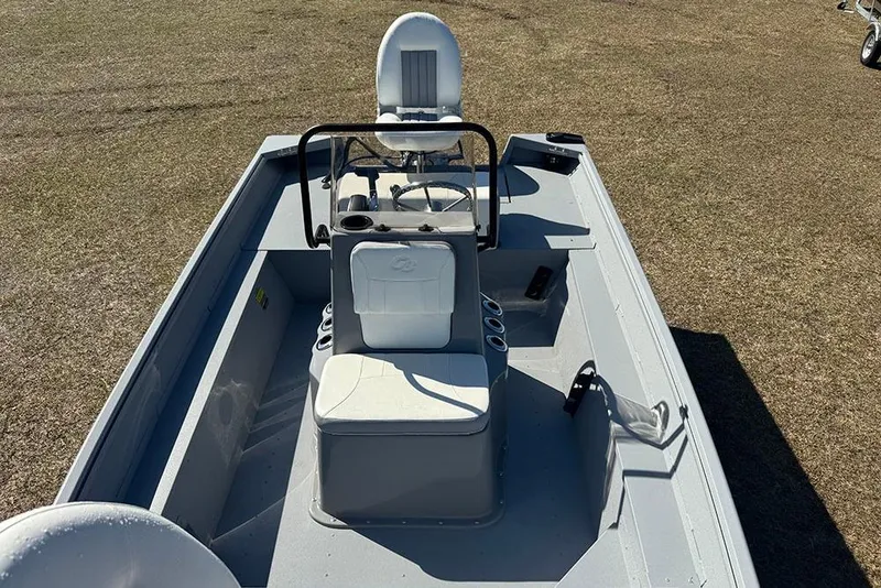 Slide: The Image of 2026 G3 Bay 17 boat interior with seating and steering console. - 16