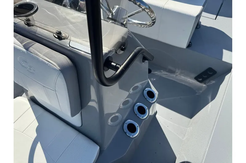 Slide: The Image of 2026 G3 Bay 17 boat interior with steering wheel and cup holders. - 19