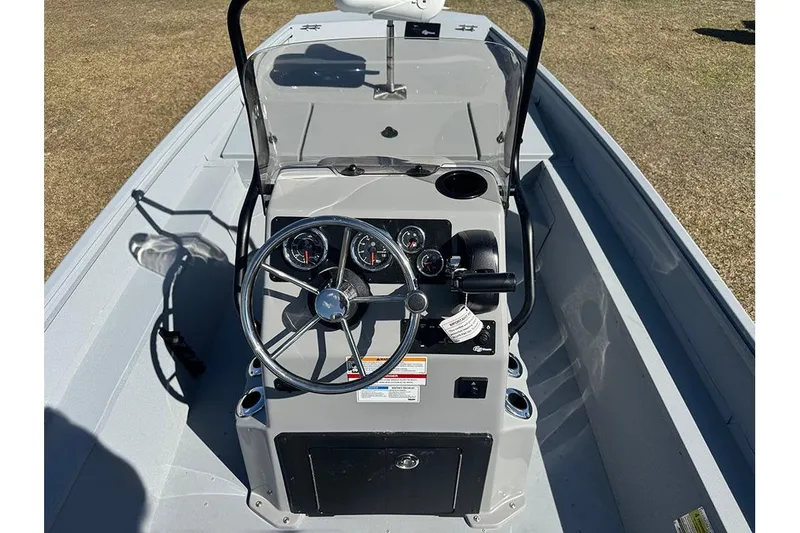 Slide: The Image of 2026 G3 Bay 17 boat interior with steering wheel and control panel. - 21