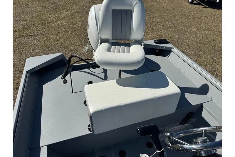 Slide: The Image of 2026 G3 Bay 17 boat interior with white seating and steering wheel. - 22