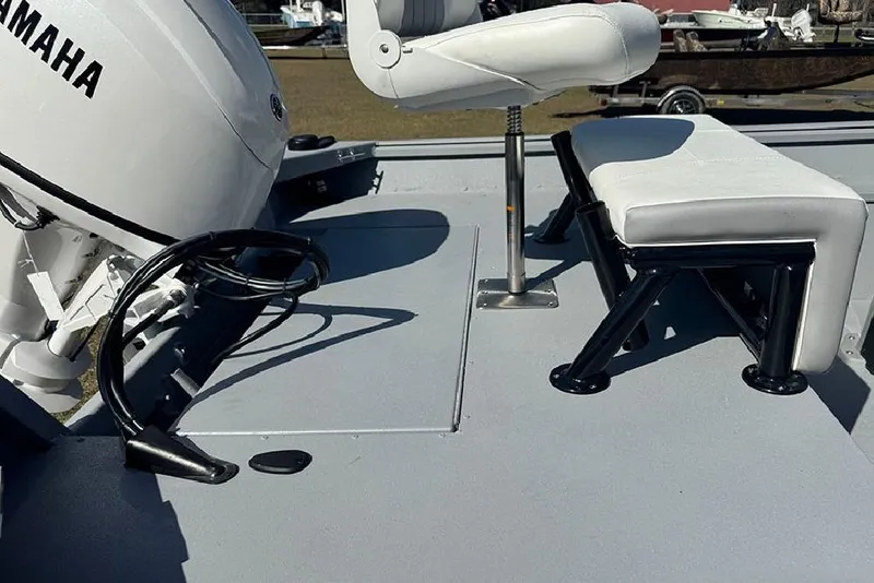 Slide: The Image of 2026 G3 Bay 17 boat interior with Yamaha motor and white seating. - 23