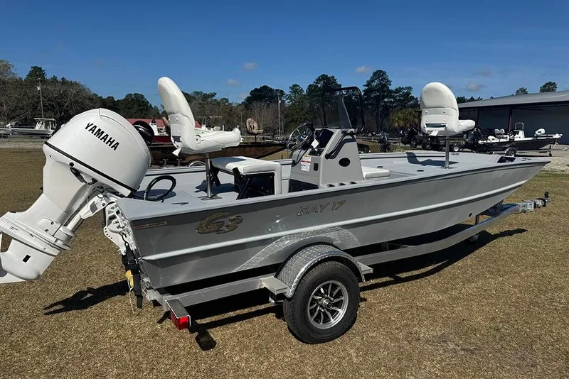 Slide: The Image of 2026 G3 Bay 17 boat with Yamaha motor on trailer, parked outdoors. - 3