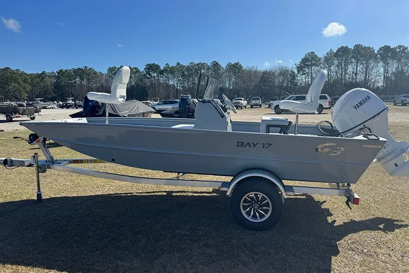 Slide: The Image of 2026 G3 Bay 17 boat on trailer, featuring Yamaha outboard motor, parked outdoors. - 6