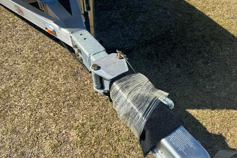 Slide: The Image of Trailer hitch of G3 Bay 17, 2026 model, secured with wrap on grass. - 9