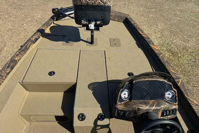 Slide: The Image of 2026 G3 Sportsman 1710 boat interior with camo accents and steering console. - 13