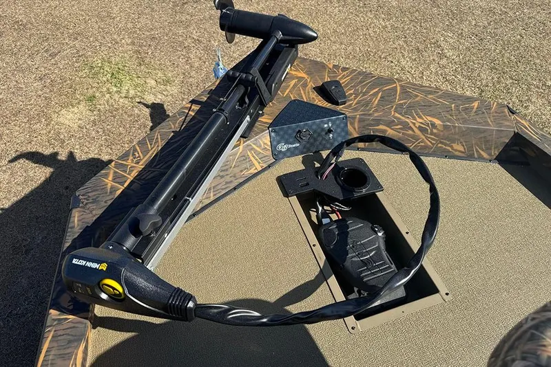 Slide: The Image of 2026 G3 Sportsman 1710 boat deck with trolling motor and control panel. - 18