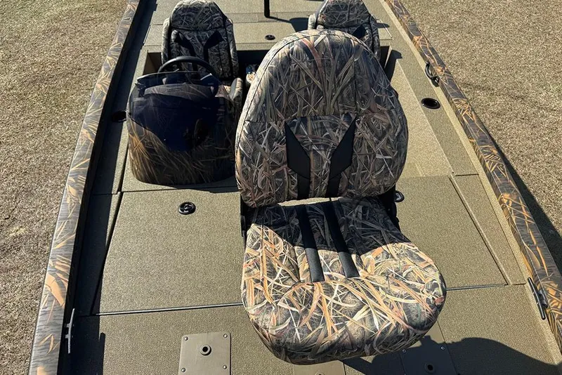 Slide: The Image of 2026 G3 Sportsman 1710 boat with camo seats and steering console. - 20