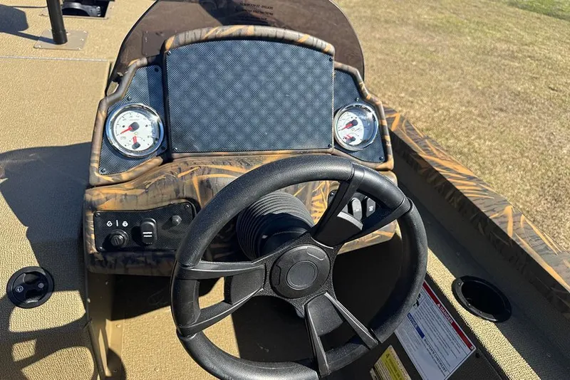 Slide: The Image of Steering console of 2026 G3 Sportsman 1710 boat with gauges and controls. - 25