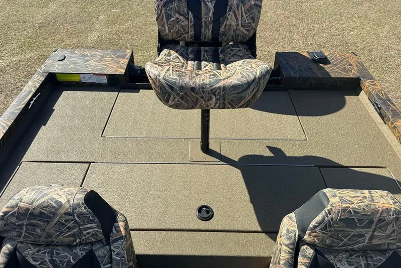 Slide: The Image of 2026 G3 Sportsman 1710 boat interior with camo seats and spacious deck. - 27
