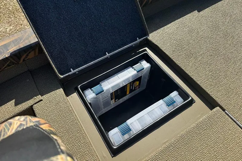 Slide: The Image of Storage compartment in 2026 G3 Sportsman 1710 boat with tackle boxes. - 29