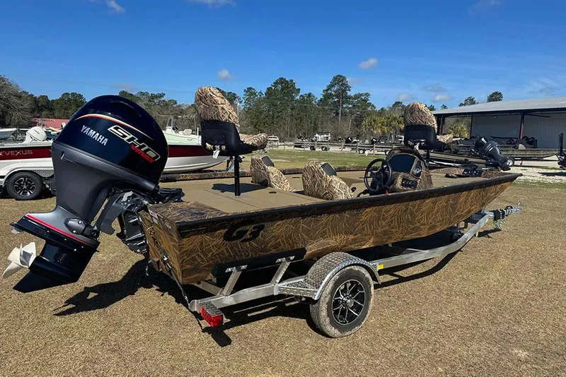 Slide: The Image of 2026 G3 Sportsman 1710 boat with Yamaha engine on trailer, outdoors. - 3