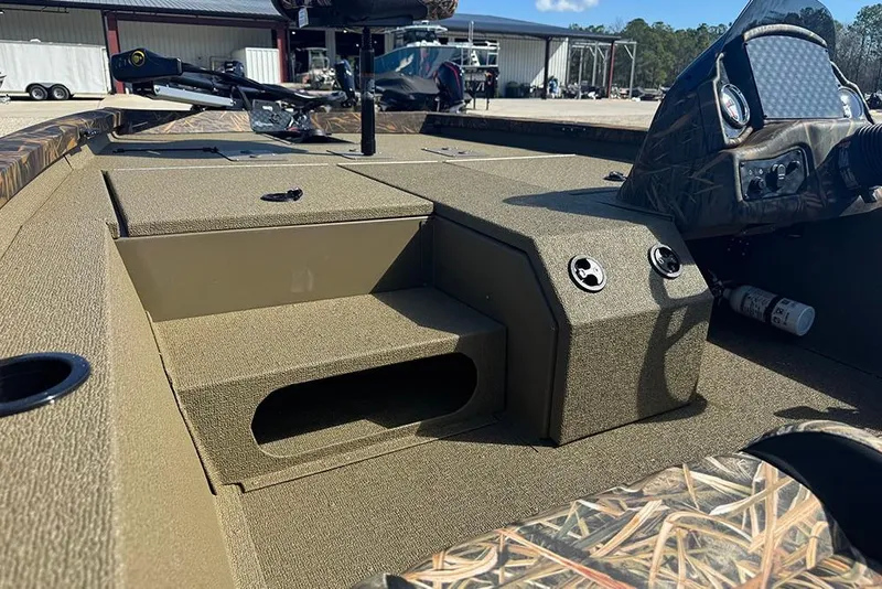 Slide: The Image of 2026 G3 Sportsman 1710 boat interior with storage compartments and control panel. - 32