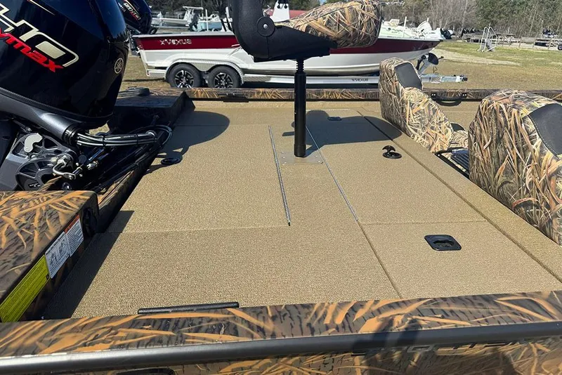 Slide: The Image of 2026 G3 Sportsman 1710 boat interior with camo seats and Yamaha engine. - 33