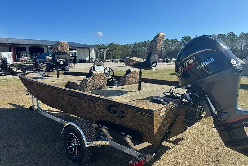 Slide: The Image of 2026 G3 Sportsman 1710 boat with Yamaha engine on trailer, outdoors. - 5