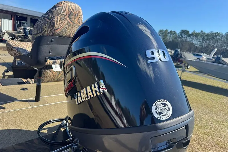 Slide: The Image of 2026 G3 Sportsman 1710 boat with Yamaha 90 engine, camo seats, sunny day. - 6