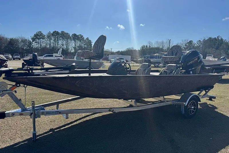 Slide: The Image of 2026 G3 Sportsman 1710 boat on trailer, parked outdoors under clear sky. - 8