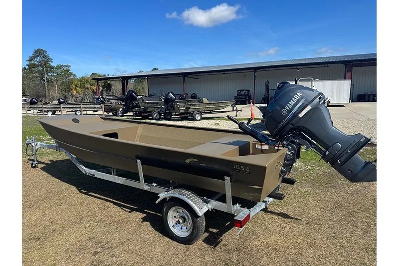 Slide: The Image of 2026 G3 Gator Tough 1652 VBW boat with Yamaha motor on trailer, outdoors. - 3
