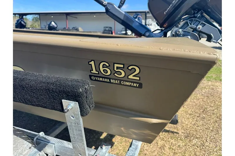 Slide: The Image of 2026 G3 Gator Tough 1652 VBW boat with Yamaha branding on trailer. - 4