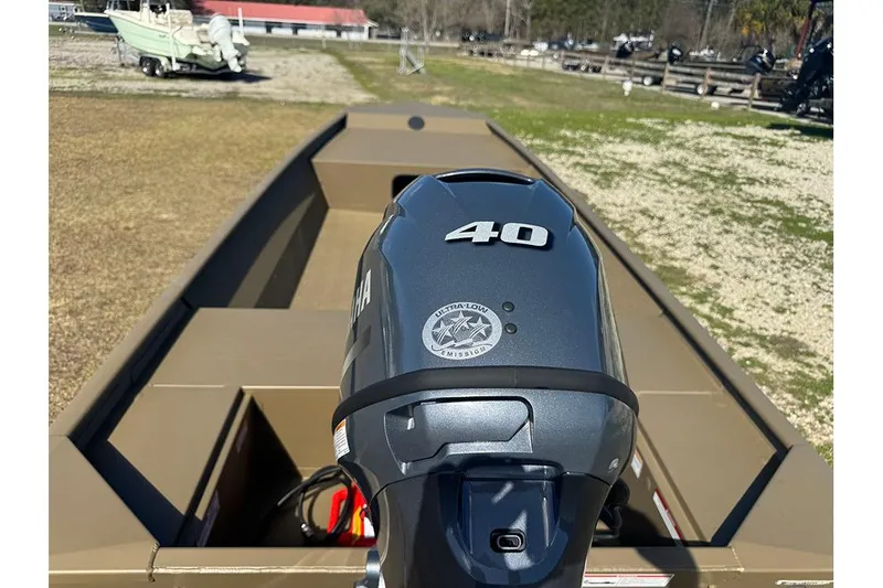 Slide: The Image of 2026 G3 Gator Tough 1652 VBW boat with Yamaha 40HP engine, parked on grass. - 5