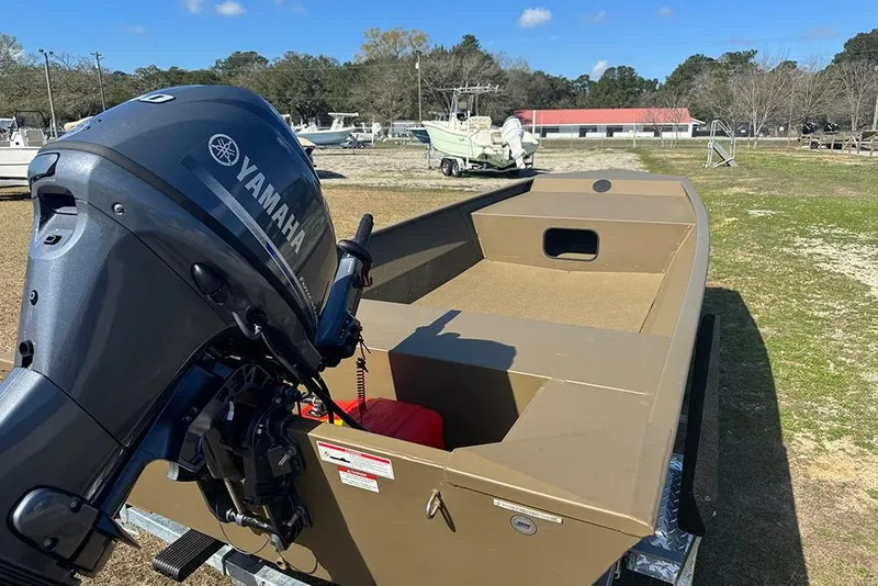 Slide: The Image of 2026 G3 Gator Tough 1652 VBW boat with Yamaha motor, parked outdoors. - 6