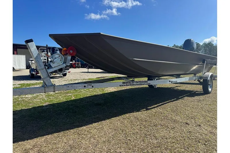 Slide: The Image of 2026 G3 Gator Tough 1652 VBW boat on trailer under clear blue sky. - 9