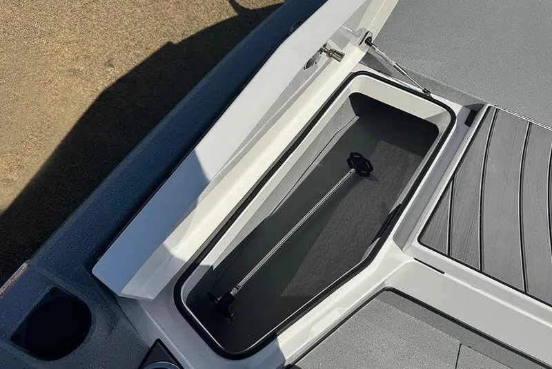 Slide: The Image of 2026 Vexus ACX 2210 boat storage compartment with open lid, showcasing interior space. - 15