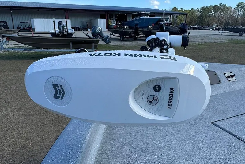Slide: The Image of Minn Kota Terrova motor on 2026 Vexus ACX 2210 boat, outdoor setting. - 21