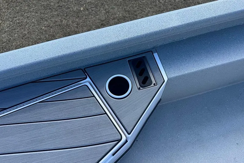 Slide: The Image of 2026 Vexus ACX 2210 boat detail with sleek deck design and cup holder. - 23