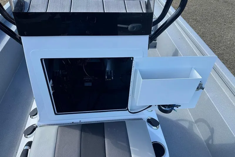 Slide: The Image of 2026 Vexus ACX 2210 boat console with open storage compartment and seating. - 28