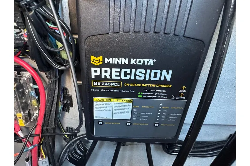 Slide: The Image of Minn Kota Precision MK 345PCL on-board battery charger in Vexus ACX 2210, 2026 model. - 30
