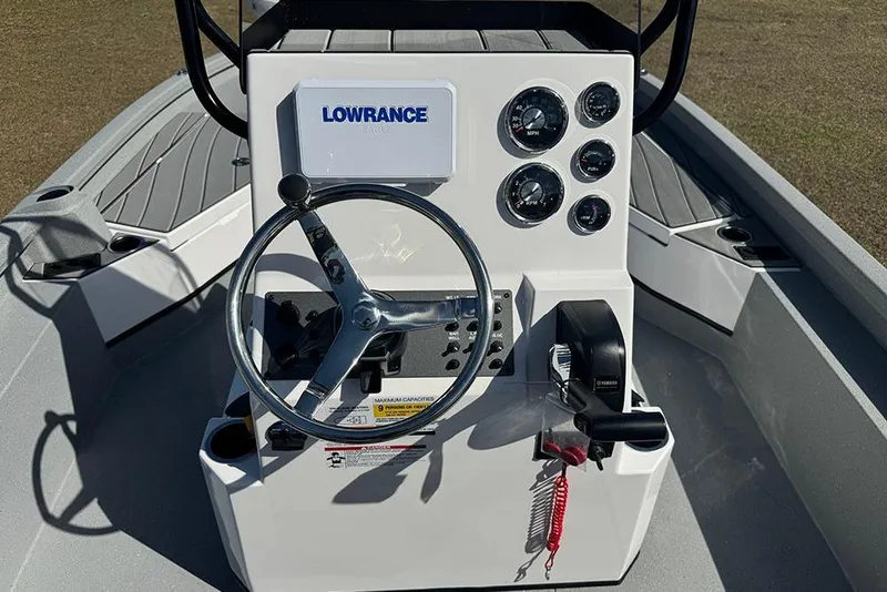 Slide: The Image of 2026 Vexus ACX 2210 boat console with steering wheel and gauges. - 32