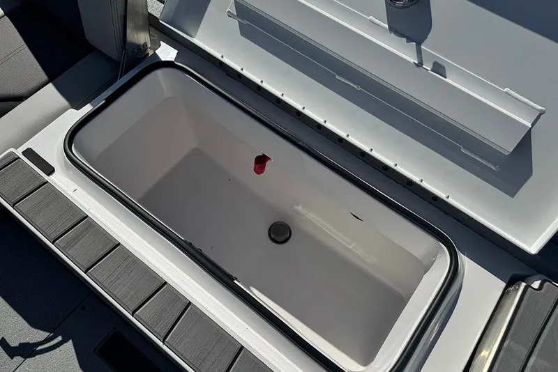 Slide: The Image of Open storage compartment in 2026 Vexus ACX 2210 boat, showcasing interior space. - 40