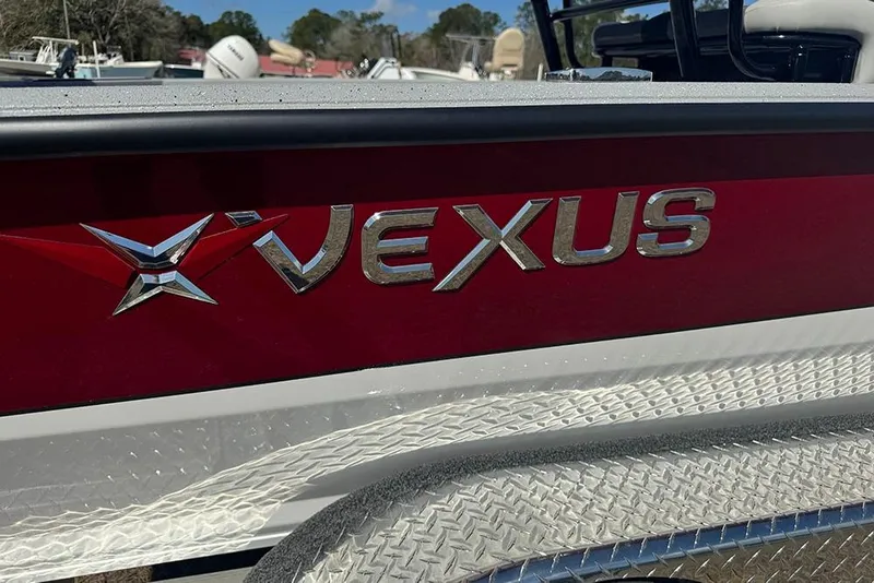 Slide: The Image of 2026 Vexus ACX 2210 boat with red and silver branding detail. - 45