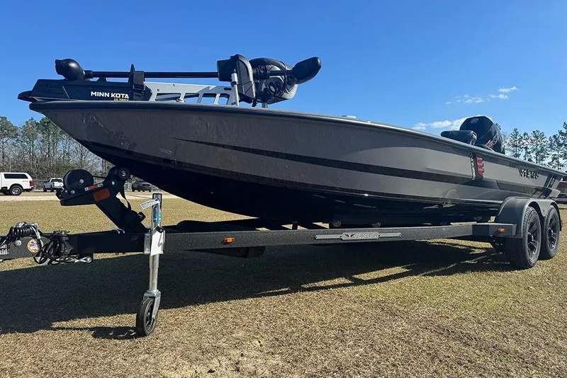 Slide: The Image of 2026 Vexus AVX 2080 boat on trailer, featuring Minn Kota trolling motor. - 11